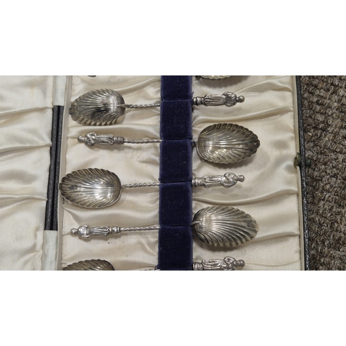 257 - A CASED SET OF SIX STERLING SILVER GILT ENAMEL BACKED SPOONS Maker's marks of Barker's Brothers Silv... 
