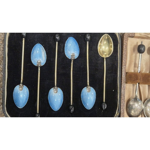 257 - A CASED SET OF SIX STERLING SILVER GILT ENAMEL BACKED SPOONS Maker's marks of Barker's Brothers Silv... 