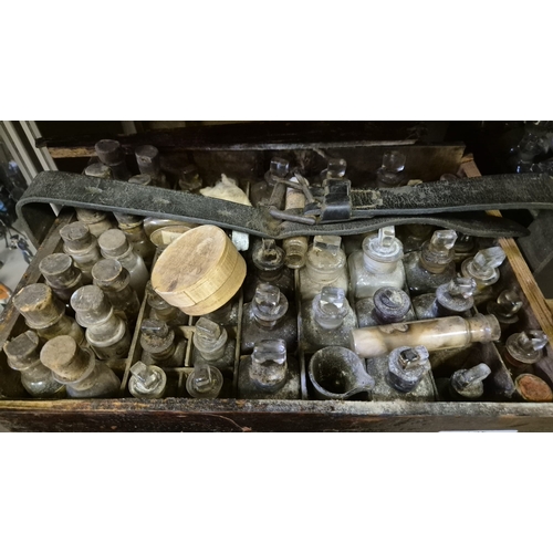 282 - A CASED APOTHECARY SET including numerous labelled vials, bottles, etc. Some still containing conten... 