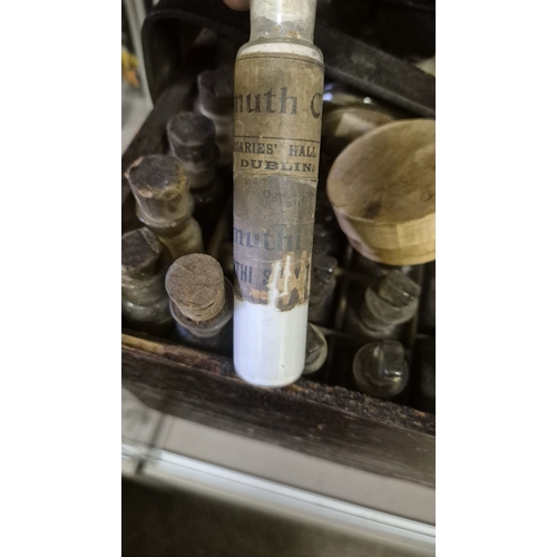 282 - A CASED APOTHECARY SET including numerous labelled vials, bottles, etc. Some still containing conten... 