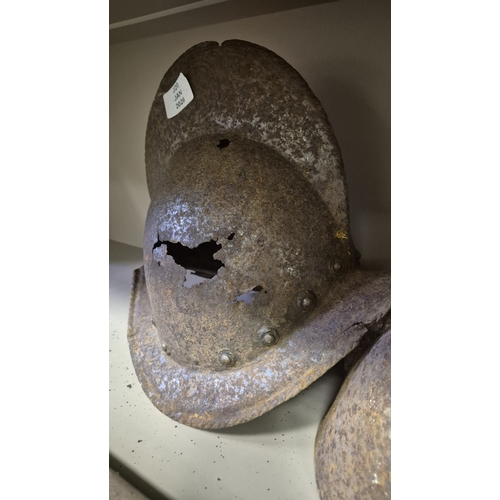 285 - A 17TH CENTURY MORION HELMET Probably Spanish. In relic condition together with two other antique he... 