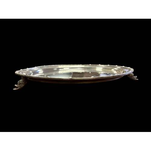 368 - AN IRISH STERLING SILVER SALVER with Celtic revival banding to rim by the Irish Silver Company Ltd.,... 