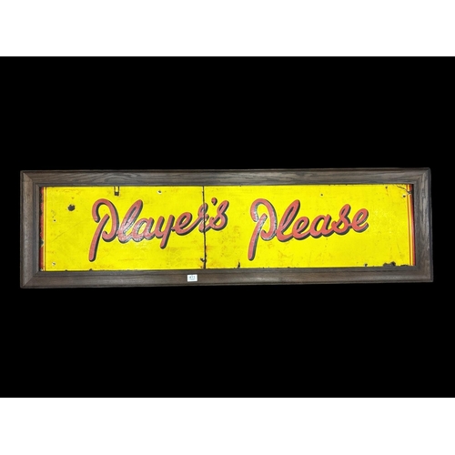 411 - A FRAMED VINTAGE ENAMEL PLAYER'S CIGARETTES ADVERTISING SIGN with the motto 'Player's Please'. In tw... 