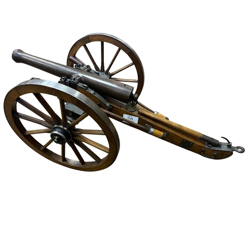 58 - A VERY GOOD SCALE MODEL OF A 19TH CENTURY FIELD ARTILLAERY CANNON with steel banded wheels and bronz... 