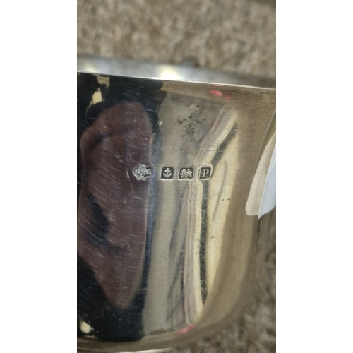255 - A STERLING SILVER SUGAR BOWL Birmingham 1939 together with a sterling silver cream jug Sheffield 193... 