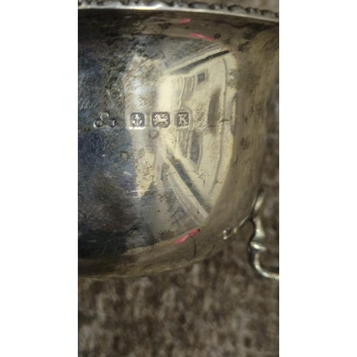 255 - A STERLING SILVER SUGAR BOWL Birmingham 1939 together with a sterling silver cream jug Sheffield 193... 
