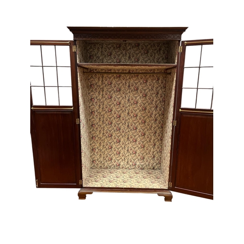 1 - A 19TH CENTURY MAHOGANY WARDROBE the dentil moulded cornice above a pair of glazed and blind panel d... 