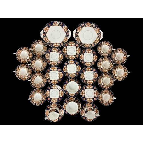 274 - A TWELVE SETTING ROYAL ALBERT BONE CHINA TEA SERVICE in the heirloom pattern with polychromatic flor... 