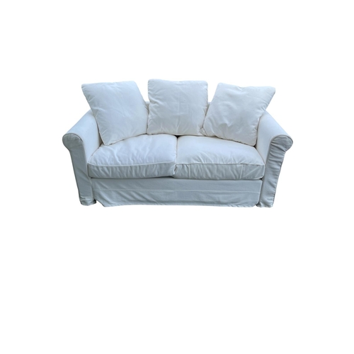 351 - A VICTORIAN STYLE TWO SEATER SETTEE the rectangular frame with scroll over arms and loose cushions o... 