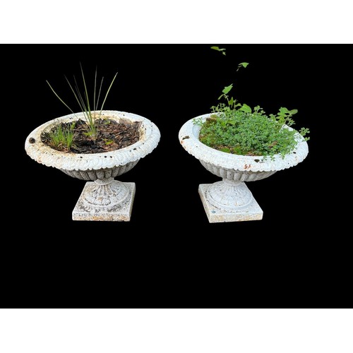 567 - A PAIR OF VICTORIAN CAST IRON GARDEN URN PLANTERS in the neo-classical style with cast egg and dart ... 