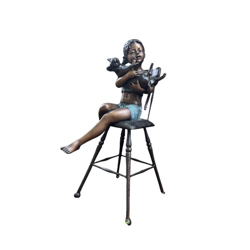 593 - A BRONZE FIGURAL SCULPTURE depicting a child seated on a high stool clutching a flailing cat 95cm (h... 