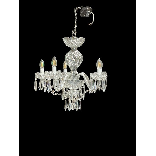 A WATERFORD CUT GLASS FIVE BRANCH CHANDELIERS hung with faceted chains and pendant drops 50cm Drop 55cm (w)