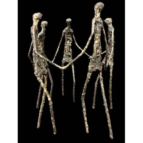 807 - in the manner of ALBERTO GIACOMETTI Five encircled figures cast iron 24cm (h)