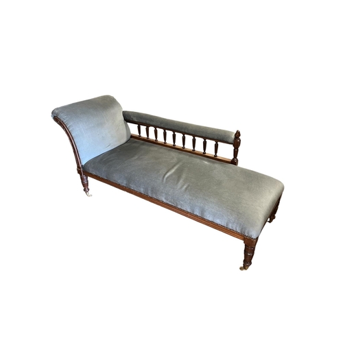 208 - A VINTAGE MAHOGANY AND UPHOLSTERED CHAISE LONGUE with scroll over upholstered back and seat and arm ... 