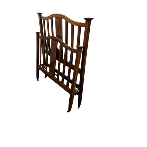 340 - AN EDWARDIAN MAHOGANY AND SATINWOOD INLAID BED the rectangular arched headboard with slatted upright... 