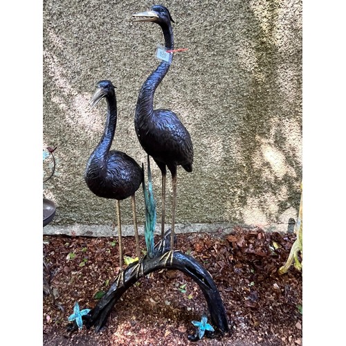 A VERY FINE BRONZE SCULPTURAL GROUP WATER FEATURE depicting a pair of herons with gilded accents stood atop a naturalistic tripod base with foliate embellishments 148cm (h)