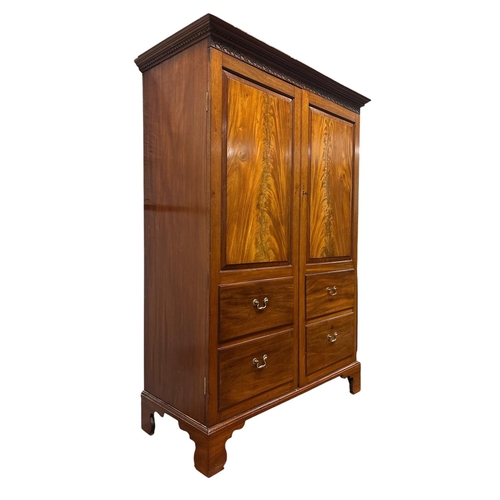 171 - A VICTORIAN FLAMED MAHOGANY TWO DOOR WARDROBE the outset cornice over Greek meander and blind fretwo... 
