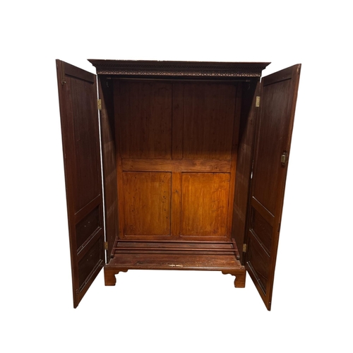 171 - A VICTORIAN FLAMED MAHOGANY TWO DOOR WARDROBE the outset cornice over Greek meander and blind fretwo... 