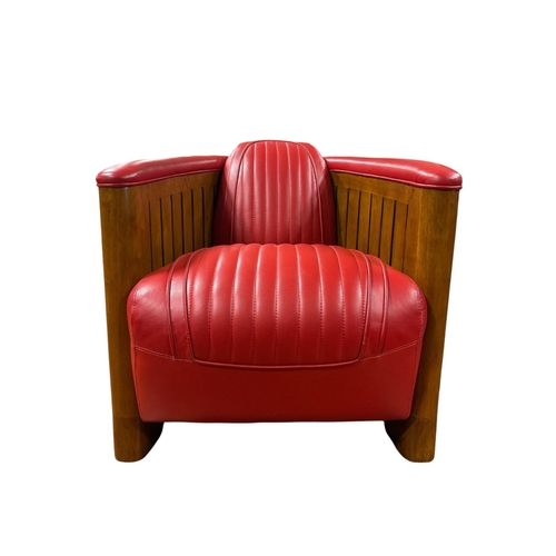 AN ART DECO STYLE WALNUT AND RED LEATHER AVIATOR ARMCHAIR with ribbed upholstery and corresponding wood panelling