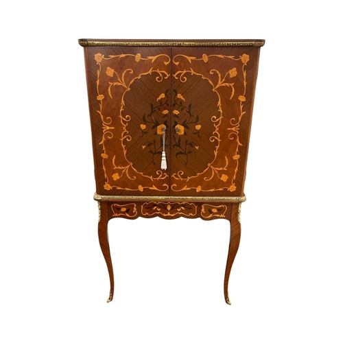 335 - A VINTAGE INLAID KINGWOOD DRINKS CABINET with floral and vegetal marquetry throughout and cast brass... 