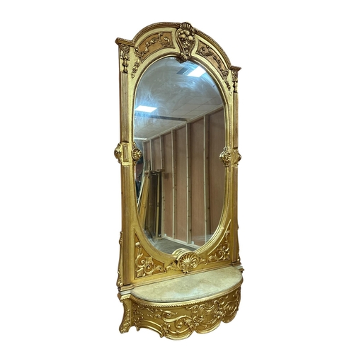 386 - A CONTINENTAL BAROQUE STYLE GILT PIER MIRROR CONSOLE the elliptical glass plate enclosed within appl... 