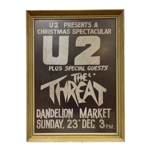 A FRAMED POSTER inscribed 'U2 presents A Christmas Spectacular, plus Special Guests The Threat, Dandelion Market, Sunday 23rd December' 66cm (h) x 48cm (w)
