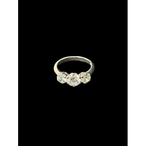 A FINE THREE STONE ILLUSION DIAMOND DRESS RING mounted in silver Ring size O