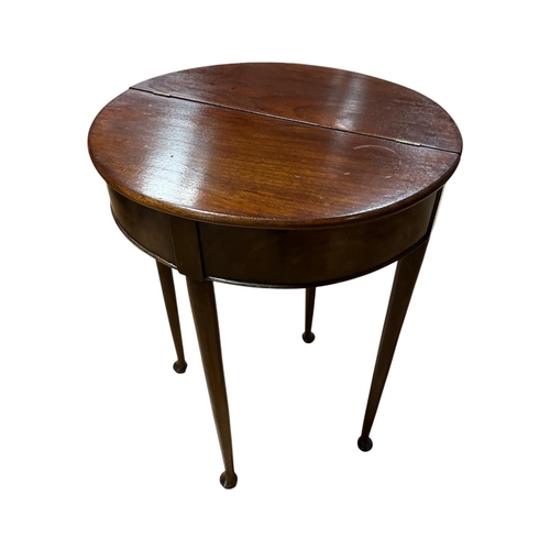 44 - A SCOTTISH VICTORIAN MAHOGANY DEMI LUNE FLIP TOP WORK TABLE the twin panel top opening onto a gatele... 