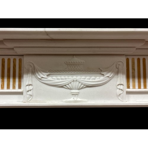 57 - A REGENCY STYLE WHITE MARBLE AND SIENNA INLAID CHIMNEY PIECE the rectangular stepped shelf above an ... 