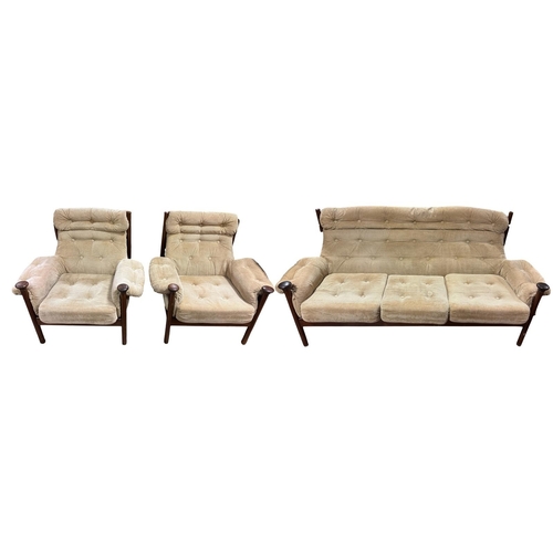 505 - A THREE PIECE MID-CENTURY ROSEWOOD LOUNGE SUITE in the style of the Guy Roger's Sante Fe range, with... 