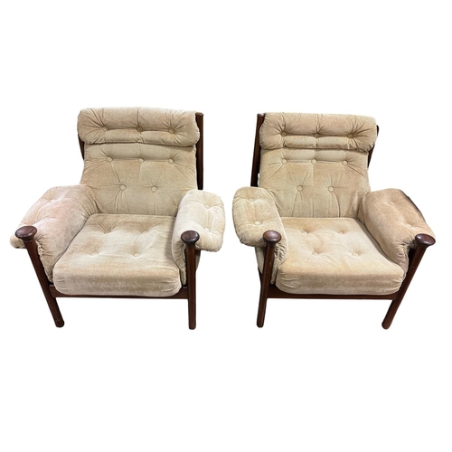 505 - A THREE PIECE MID-CENTURY ROSEWOOD LOUNGE SUITE in the style of the Guy Roger's Sante Fe range, with... 