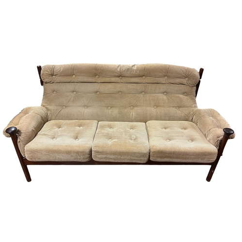 505 - A THREE PIECE MID-CENTURY ROSEWOOD LOUNGE SUITE in the style of the Guy Roger's Sante Fe range, with... 