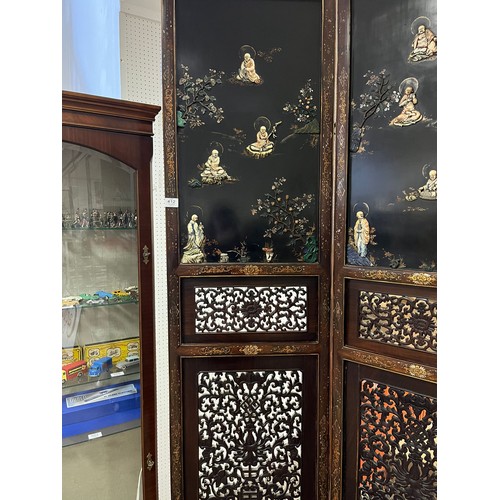 373 - A CHINESE LACQUERED BLACKWOOD FOUR FOLD SCREEN 19th century. Qing Dynasty. Solid top panels applied ... 
