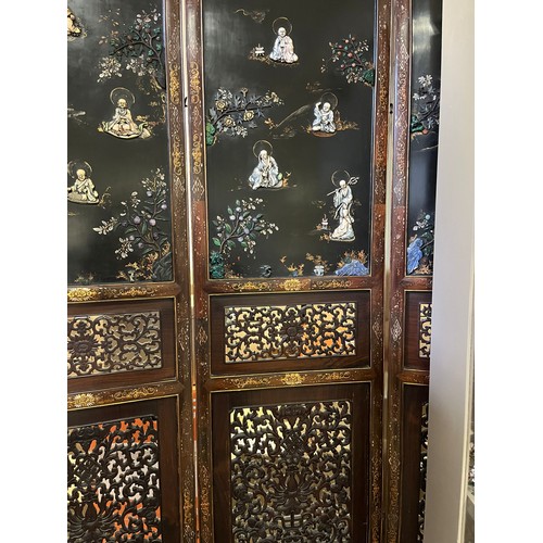 373 - A CHINESE LACQUERED BLACKWOOD FOUR FOLD SCREEN 19th century. Qing Dynasty. Solid top panels applied ... 
