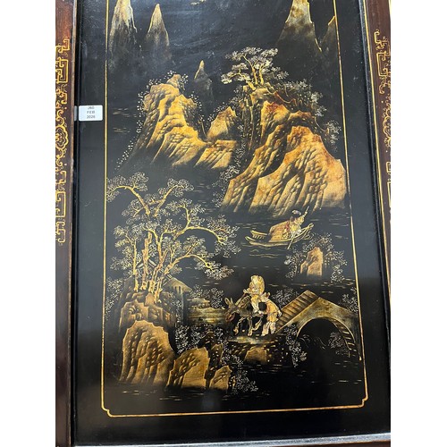 373 - A CHINESE LACQUERED BLACKWOOD FOUR FOLD SCREEN 19th century. Qing Dynasty. Solid top panels applied ... 