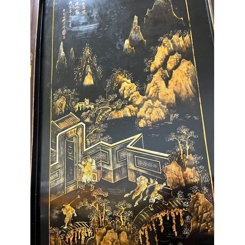 373 - A CHINESE LACQUERED BLACKWOOD FOUR FOLD SCREEN 19th century. Qing Dynasty. Solid top panels applied ... 