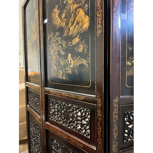 373 - A CHINESE LACQUERED BLACKWOOD FOUR FOLD SCREEN 19th century. Qing Dynasty. Solid top panels applied ... 