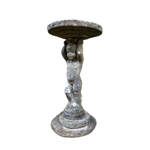 374 - A STONE COMPOSITE FIGURAL BIRDBATH in four sections with stem in the form of a putti 80cm (h)