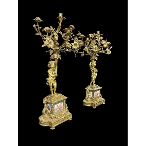 139 - A FINE PAIR OF 19TH CENTURY FRENCH GILT BRONZE, COPPER AND PORCELAIN FIVE LIGHT FIGURAL CANDELABRA e... 