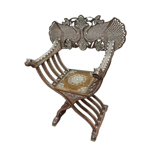 219 - A VINTAGE INDIAN ROSEWOOD BONE AND EBONY INLAID SAVONAROLA ARMCHAIR the fan shaped back with panelle... 
