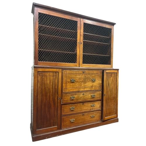 234 - A GEORGIAN MAHOGANY SECRETAIRE BOOKCASE the moulded cornice above a pair of brass grill doors contai... 
