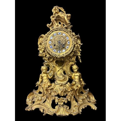 271 - A FRENCH 19TH CENTURY GILT BRONZE THREE PIECE CLOCK GARNITURE comprising a large Rococo style mantel... 