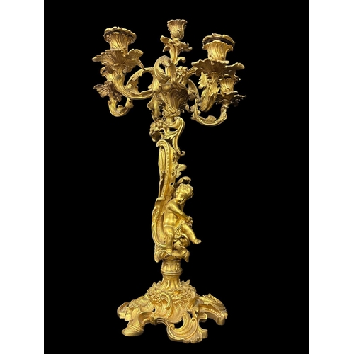 271 - A FRENCH 19TH CENTURY GILT BRONZE THREE PIECE CLOCK GARNITURE comprising a large Rococo style mantel... 