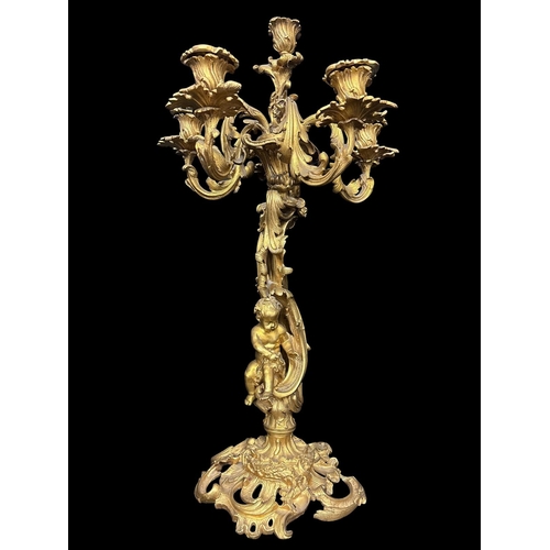 271 - A FRENCH 19TH CENTURY GILT BRONZE THREE PIECE CLOCK GARNITURE comprising a large Rococo style mantel... 