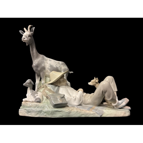 273 - A LARGE LLADRO PORCELAIN FIGURAL GROUP of shepherd sleeping alongside a nanny goat, kid and dog 36cm... 