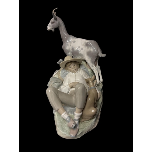 273 - A LARGE LLADRO PORCELAIN FIGURAL GROUP of shepherd sleeping alongside a nanny goat, kid and dog 36cm... 