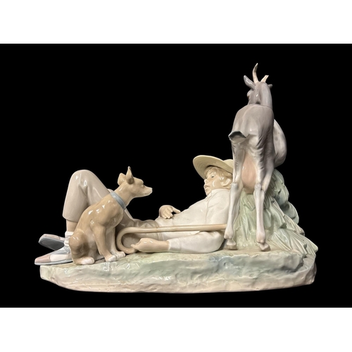 273 - A LARGE LLADRO PORCELAIN FIGURAL GROUP of shepherd sleeping alongside a nanny goat, kid and dog 36cm... 