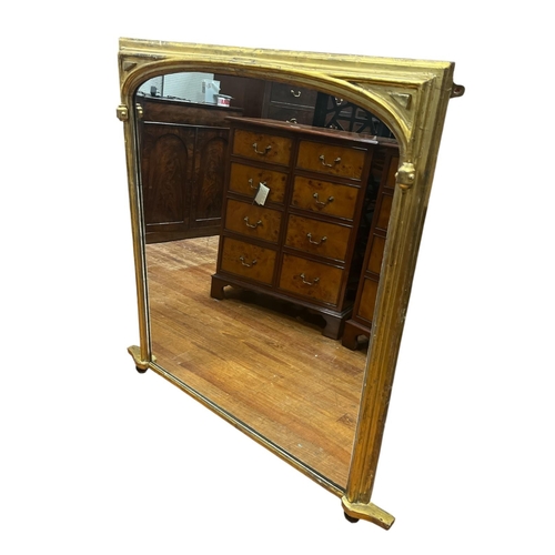 316 - A 19TH CENTURY CARVED GILTWOOD AND GESSO OVERMANTEL MIRROR the rectangular glass plate with domed to... 