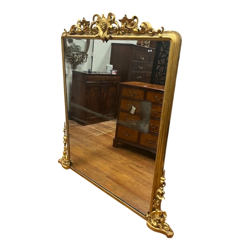317 - A 19TH CENTURY GILTWOOD AND GESSO OVERMANTEL MIRROR the plain rectangular glass plate beneath a pier... 