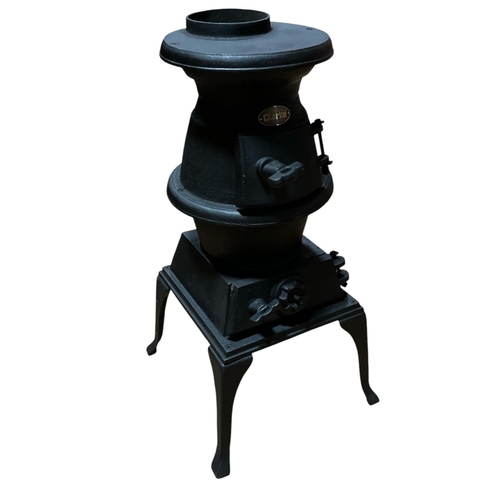 371 - A CAST IRON STOVE with 'Clarke' nameplate elevated on a bracketed cabriole legged frame 65cm (h) x 2... 